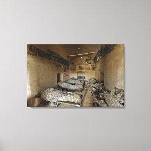 US Soldiers sleep in an abandoned mud house Canvas Print