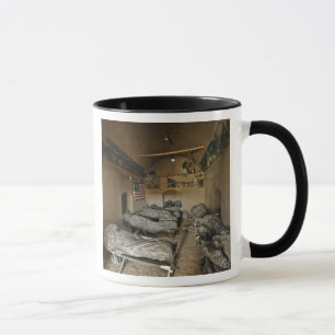 US Soldiers sleep in an abandoned mud house Mug