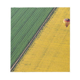 USA, Arizona, Val Vista. Hot-air balloons soar Notepad