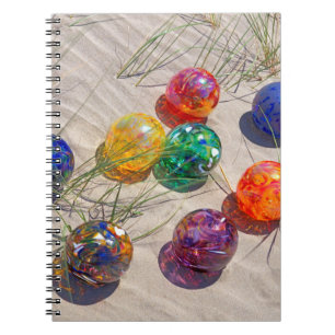 USA, Oregon. Colourful Glass Floats On Sand Dune Spiral Notebook