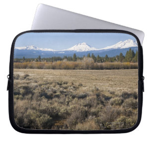 USA, Oregon, Field with snow covered Cascade Laptop Sleeve