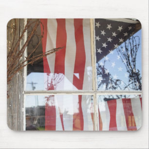 USA, Oregon, Shaniko. Flag in window next to Mouse Pad