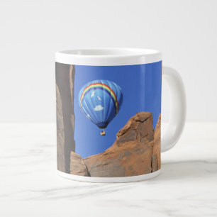 USA, Utah, Monument Valley. A rainbow hot-air Large Coffee Mug