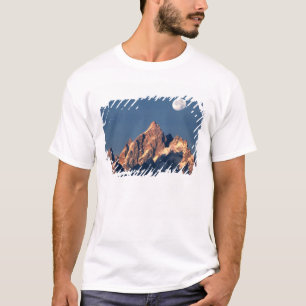 USA, Wyoming, Grand Teton NP. A full moon sets T-Shirt