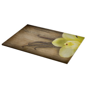 Vanilla Pods and Flower over Wooden Background Cutting Board