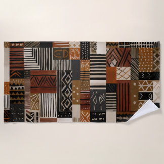 Variations of African motifs in earth tones Beach Towel