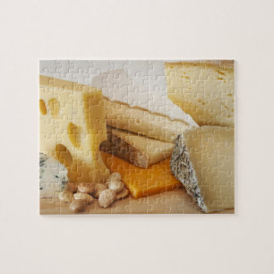 Various cheeses on chopping board jigsaw puzzle