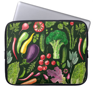 Vegetable and herbs garden harvest on black laptop sleeve