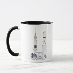 Vials containing medicine for injections and mug