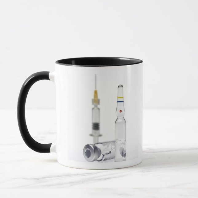 Vials containing medicine for injections and mug (Left)