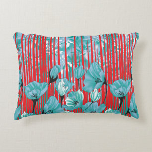Vibrant floral pattern with turquoise flowers, red decorative cushion