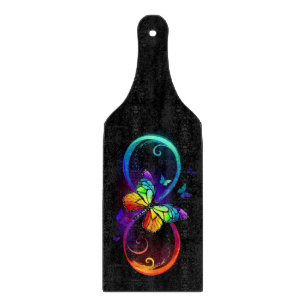 Vibrant infinity with rainbow butterfly on black  cutting board