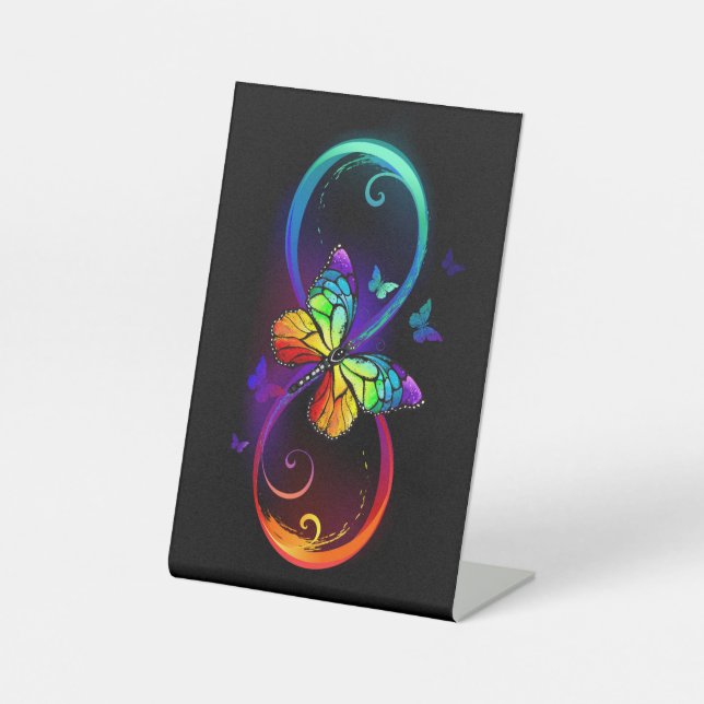 Vibrant infinity with rainbow butterfly on black pedestal sign (Front)