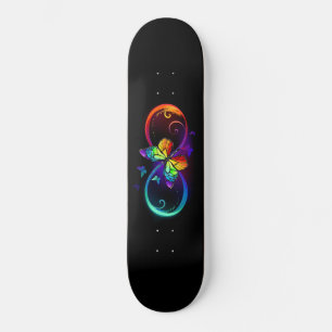 Vibrant infinity with rainbow butterfly on black skateboard