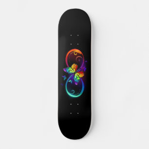Vibrant infinity with rainbow butterfly on black skateboard