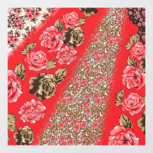 Vibrant red fabric featuring intricate floral and