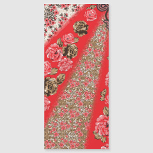 Vibrant red fabric featuring intricate floral and 