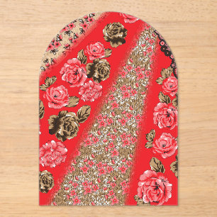 Vibrant red fabric featuring intricate floral and acrylic invitations