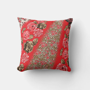 Vibrant red fabric featuring intricate floral and cushion