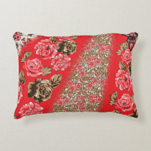 Vibrant red fabric featuring intricate floral and decorative cushion