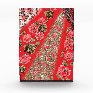 Vibrant red fabric featuring intricate floral and photo block