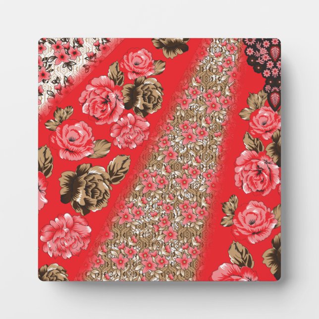 Vibrant red fabric featuring intricate floral and  plaque (Front)