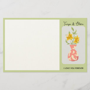 Vibrant yellow flower arrangement in a modern vase stationery