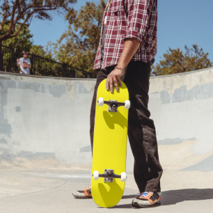 vibrant yellow skateboard features a clean