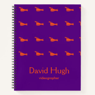 Video camera orange silhouette purple notebook