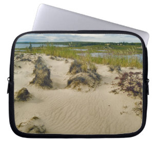 View from a sandy hilltop of lakes and hills on laptop sleeve
