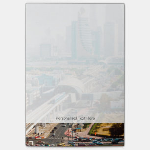 View of city metro line and skyscrapers post-it notes