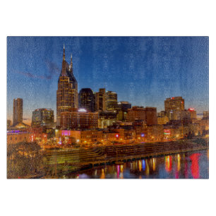 View of the city skyline at dusk cutting board