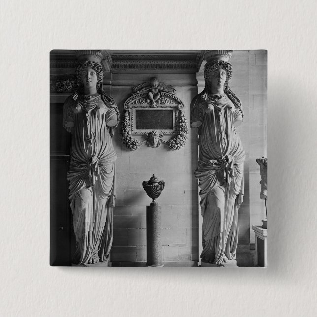 View of two caryatids from the Caryatids' 15 Cm Square Badge (Front)