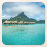 View on Bora Bora island coaster<br><div class="desc">Coaster with a luxury overwater thatched roof bungalow resort in a vacation resort in the clear blue lagoon with a view on the tropical island of Bora Bora,  near Tahiti,  in French Polynesia.</div>