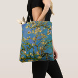 Vincent van Gogh - Blossoming Almond Tree Tote Bag<br><div class="desc">Blossoming Almond Tree (1890) by Van Gogh is a vintage post impressionism fine art floral still life painting. A branch from an almond tree in bloom in a spring garden with the blue sky in the background. Beautiful blooming white flowers. About the artist: Vincent Willem van Gogh (1853-1890) was a...</div>