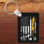 Vintage American Flag Lineman Electrician Tools Key Ring<br><div class="desc">Whether they’re climbing poles in a storm or maintaining the grid, an electrician’s job is never done. This distressed, patriotic design on a keychain celebrates the skill and bravery of powerline workers. Featuring a retro aesthetic with a focus on the tools of the trade and the Stars and Stripes, this...</div>