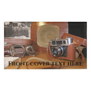 Vintage analogue camera in leather brown case name tag