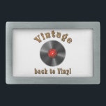 Vintage - Back to Vinyl, the record is back Belt Buckle<br><div class="desc">The image shows a vinyl record,  a type of physical audio recording format made from vinyl material. The phrase "back to basics" suggests a return to older,  traditional forms. The feeling of nostalgia for music and the desire for the past to become current again</div>