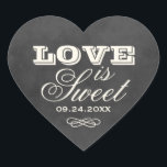 Vintage Black Chalkboard Love is Sweet Wedding Heart Sticker<br><div class="desc">Whimsical wedding favour stickers in a heart shape feature "Love is Sweet" with a monogram of the bride and groom names and wedding date and with a soft white chalk appearance on a rustic black board background with textured look.</div>