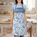 Vintage Blue Floral Toile Monogram Apron<br><div class="desc">Elevate your kitchen style with this gorgeous blue floral apron, personalised just for you! Featuring a timeless blue and white toile-style botanical pattern that evokes classic elegance, this apron is as beautiful as it is functional. The rich blue chest panel is customised with a graceful script, making it a perfect...</div>