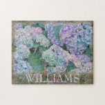 Vintage Blue Hydrangea Floral Family Name Jigsaw Puzzle<br><div class="desc">This gorgeous floral jigsaw puzzle features blue hydrangea blossoms in shades of blue and lavender. Below is your name to personalize in a classic font. Designed by world renowned artist Tim Coffey.</div>