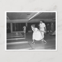 Vintage bowling alley woman in white dress