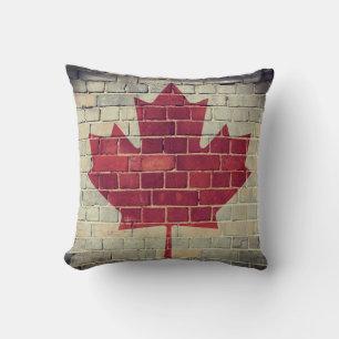 Vintage Canada flag on a brick wall Cushion