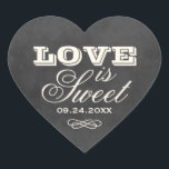 Vintage Chalkboard Love is Sweet Wedding Heart Sticker<br><div class="desc">Rustic wedding favour stickers in a charming heart shape featuring the "Love is Sweet" featured text in vintage typography on a black chalkboard-style background with an elegant scrollwork flourish and wedding date. A striking seal for candy favours, dessert bar packaging, or sweet treat bags at your wedding celebration. All text...</div>