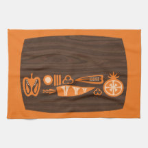 Vintage chopping board and orange veg, tea towel