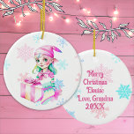 Vintage Christmas Elf Girl in Pink  Ceramic Tree Decoration<br><div class="desc">Pretty personalised Christmas ornament with a cute retro female elf in a pink hat surrounded by falling pink and blue snowflakes. The back can be personalised with a custom message.</div>