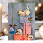 Vintage Christmas Kittens and Gifts Holiday Card<br><div class="desc">Share the joy of the holiday season with this charming vintage Christmas card featuring playful kittens among beautifully wrapped gifts and festive decorations. The nostalgic design captures the innocence and fun of Christmas, perfect for cat lovers and those who appreciate vintage holiday themes. The delightful scene of kittens exploring presents...</div>