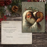 Vintage Father Christmas in Snow with Yule Log Postcard<br><div class="desc">Artistic vintage Robert Finlay McIntyre portrait of white-robed Father Christmas carrying a Yule log in the snow. Back features complementary sepia background with editable text fields.</div>