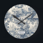 Vintage floral chic Blue toile de jouy monogram Round Clock<br><div class="desc">Elegant vintage Blue toile de jouy monogram wall clocks. Beautiful seamless toile de jouy pattern Blue on white background.Toile prints are an all time rage at the moment, this is an elegant and ornate vintage toile de jouy featuring exotic damask pattern, a fun style that is currently trending for home...</div>
