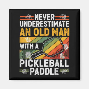 Vintage grandpa underestimate an old man with a magnet
